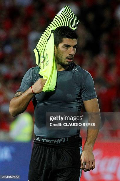 Uruguay's Luis Suarez leaves the field in dejection after losing to Chile in a 2018 FIFA World Cup qualifier football match in Santiago, on November...