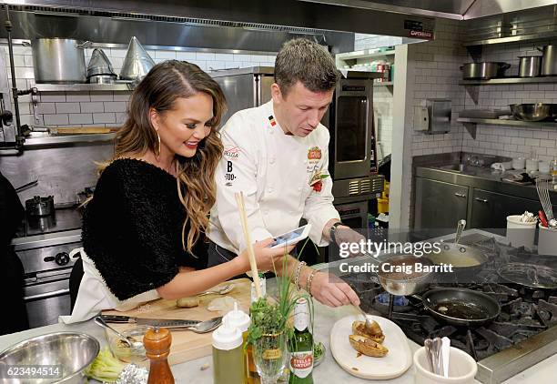 Belgian Chef Bart Vandaele leads a traditional Belgian cooking demonstration with Chrissy Teigen as part of the 'King's Feast' to celebrate a season...