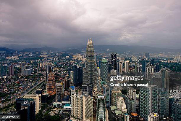 general views of kuala lumpur in cloudy day - skybridge petronas twin towers stock pictures, royalty-free photos & images