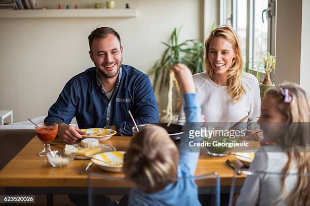 family lunch at home - family with two children stock pictures, royalty-free photos & images