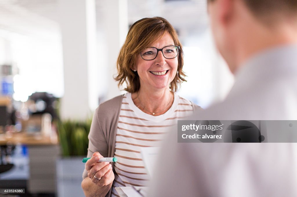 Woman boss speaking with her colleague