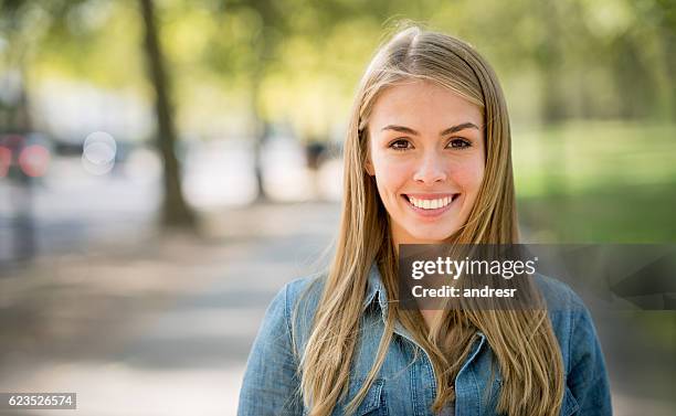 happy woman at the park - cute blonde women 個照片及圖片檔