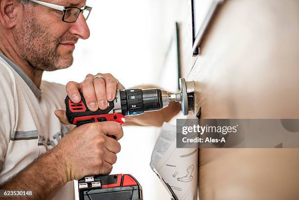 handyman at work - locksmith stock pictures, royalty-free photos & images