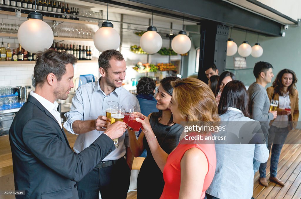 Group of friends having drinks after work