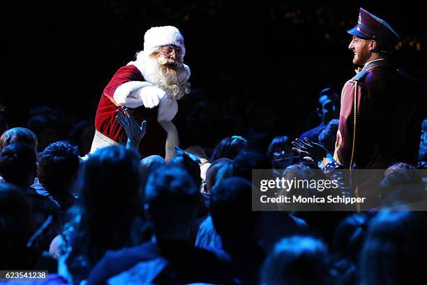 Santa greets guests during the "Christmas Spectacular Starring The Radio City Rockettes" Opening Night at Radio City Music Hall on November 15, 2016...