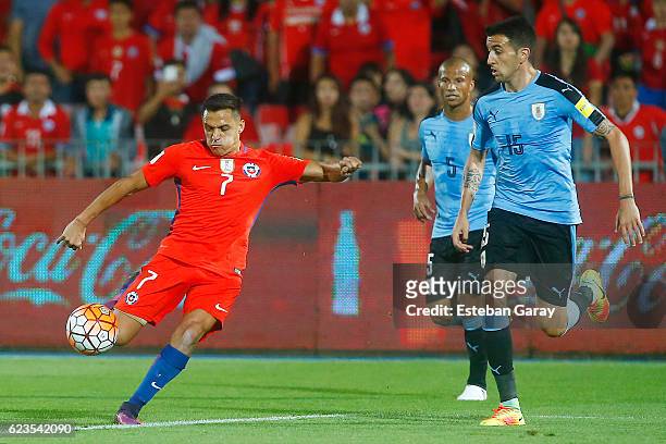 Alexis Sanchez of Chile shoots to score the second goal of his team during a match between Chile and Uruguay as part of FIFA 2018 World Cup...