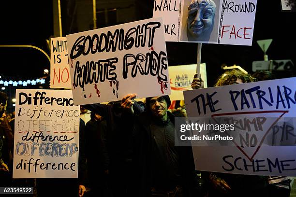 Protesters hold anti-Trump banners during a demonstration against US president Obama visit in Athens, Greece on November 15, 2016.