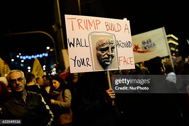 Protesters hold anti-Trump banners during a demonstration against US president Obama visit in Athens, Greece on November 15, 2016.