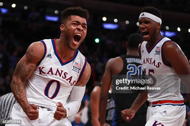 Frank Mason III and Carlton Bragg Jr. #15 of the Kansas Jayhawks react after a foul against the Duke Blue Devils in the second half during the State...