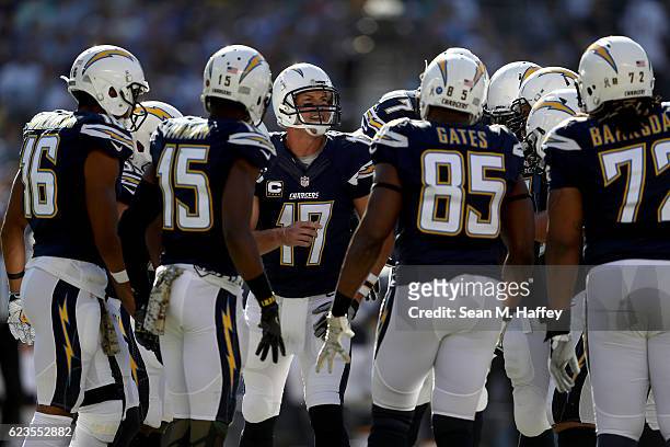 Philip Rivers, Melvin Gordon, Antonio Gates, and King Dunlap of the San Diego Chargers huddle during a game against the Miami Dolphins at Qualcomm...