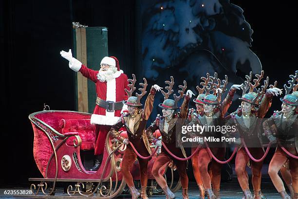 Santa Claus and the Rockettes perform on stage during the 2016 Radio City Christmas Spectacular Opening Night at Radio City Music Hall on November...