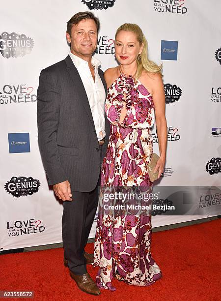 Actor Grant Snow L) and Katherine LaNasa arrive at the Los Angeles Premiere of LOVE IS ALL YOU NEED? at ArcLight Hollywood on November 15, 2016 in...