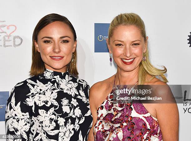 Actress Briana Evigan and Katherine LaNassa arrive at the Los Angeles Premiere of LOVE IS ALL YOU NEED? at ArcLight Hollywood on November 15, 2016 in...
