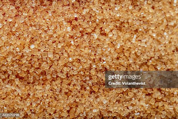 brown sugar crystals, macro closeup - sugar pile stock pictures, royalty-free photos & images