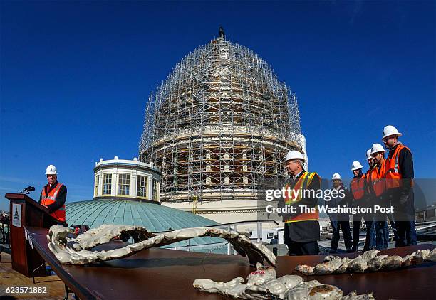 Stephen Ayers, left, the Architect of the Capitol, briefs assembled press on the progress of the U.S. Capitol Dome Restoration Project on November...