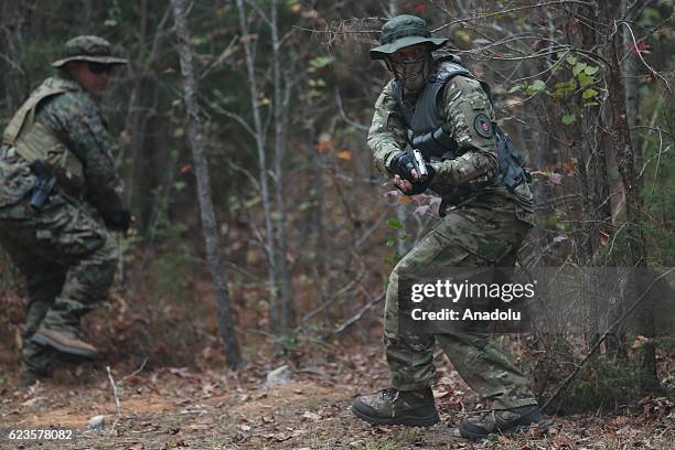 Members of the Georgia Security Forces are seen during military drill with other group members of III% Georgia Security Force in Flovilla, Georgia,...