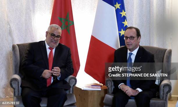 French President Francois Hollande meets Moroccan Prime Minister Abdelilah Benkirane on the sidelines of the COP22 Climate Change Conference in...
