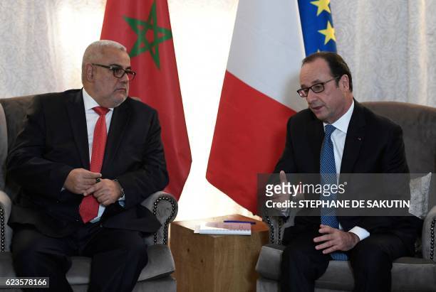 French President Francois Hollande meets Moroccan Prime Minister Abdelilah Benkirane on the sidelines of the COP22 Climate Change Conference in...