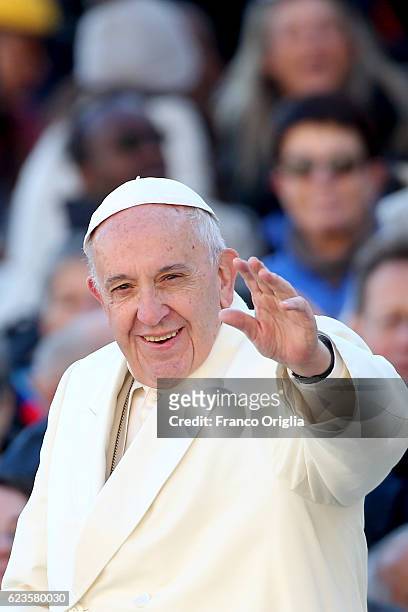 Pope Francis waves to faithful and pilgrims gathered in St. Peter's Square during the weekly audience on November 16, 2016 in Vatican City, Vatican....