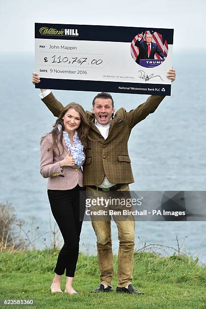 John Mappin, owner of the Camelot Castle Hotel in Tintagel, Cornwall, with his wife Irina and a cheque for &pound;100,000 he received from William...