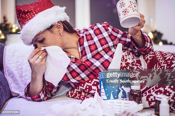 fever on new year's eve - cold virus stock pictures, royalty-free photos & images