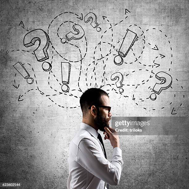 confused and stressed businessman - manquestionmark stock pictures, royalty-free photos & images