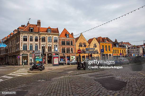 traditional old buildings by street at lille france - lille cafe stock pictures, royalty-free photos & images