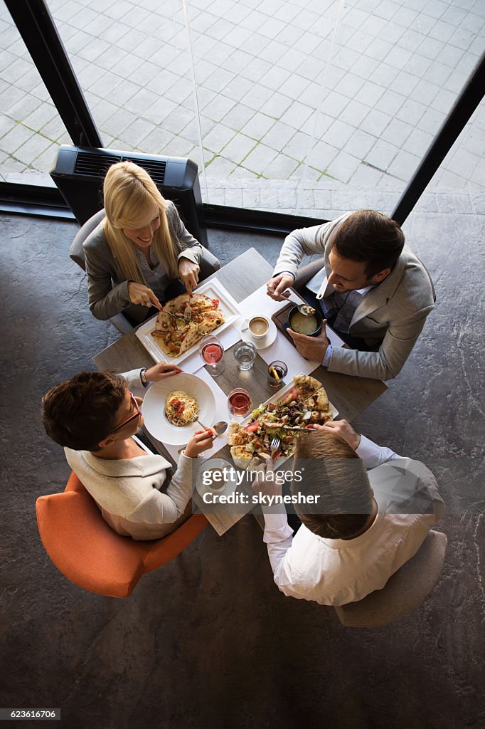 Above view of business people having a lunch in restaurant.