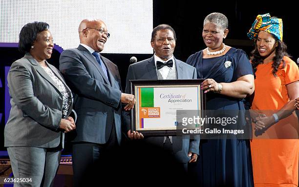 President Jacob Zuma and Ethekwini mayor Zandile Gumede honour Ladysmith Black Mambazos retired lead vocalist; Joseph Shabalala with a certificate of...