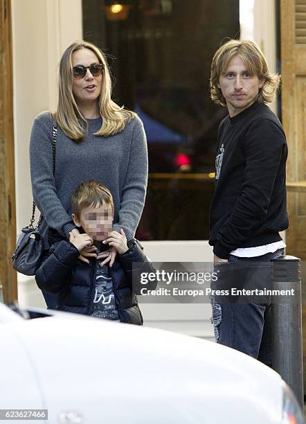 Real Madrid football player Luka Modric, his wife Vanja Bosnic Modric and their son Ivano Modric are seen leaving 'Quintint' restaurant on November...