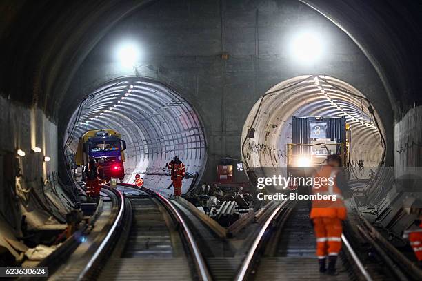 Employees stand in the tunnels at the Stepney Green interchange, developed by Crossrail, as it runs beneath London, U.K., on Wednesday, Nov. 16,...