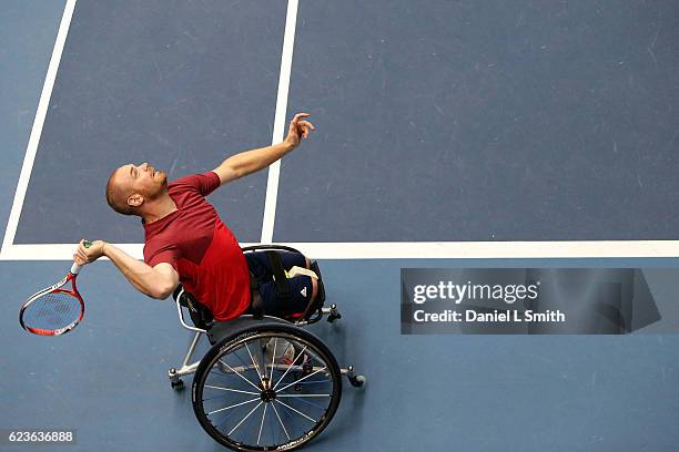 Maikel Scheffers of the Netherlands serves the ball during the his men's doubles match with Gustavo Fernandez of Argentina playing Umberto Carmelo...