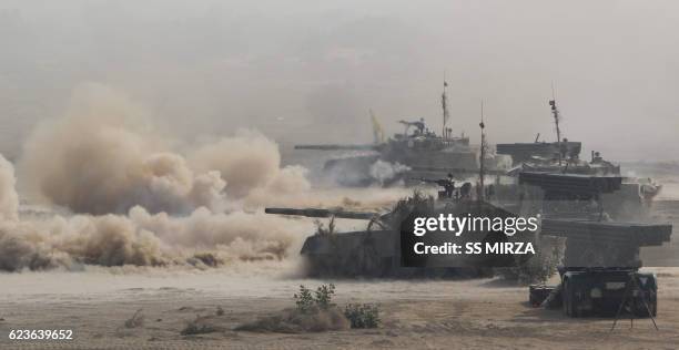 Pakistani army tanks advance during a military exercise at a trategic area along the border with India, in Khairpure Tamay Wali in Bahawalpur...