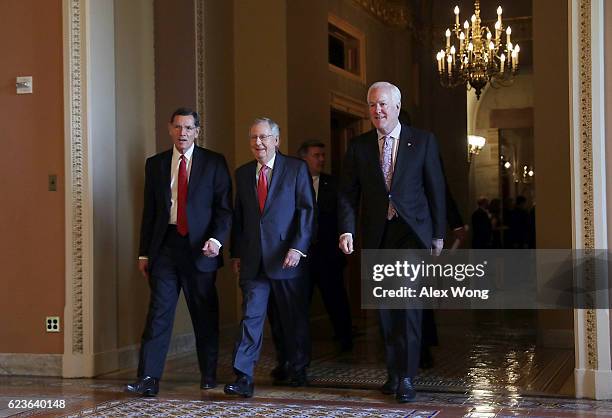 Sen. John Barrasso , Senate Majority Leader Sen. Mitch McConnell and Senate Majority Whip John Cornyn leave after an election meeting of Senate...