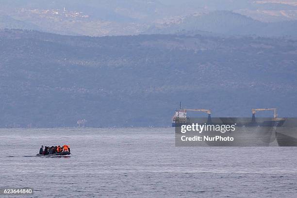 Syrian and many Afghan migrants / refugees arrive from Turkey on boat through sea with cold water near Molyvos, Lesbos on overloaded dinghies....