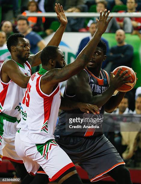 DaJuan Summers of Pinar Karsiyaka and Will Yeguete of Le Mans vie for the ball during their Basketball Champions League Group B match at Mustafa...