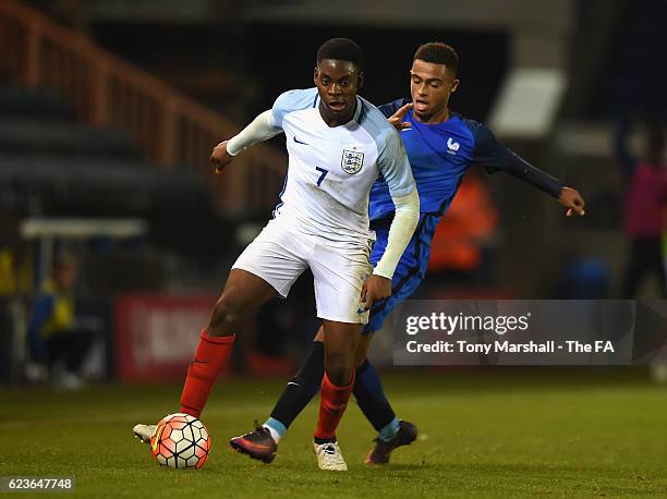 Jonathan Leko of England U18 holds off a challenge from Antoine Bernede of France U18 during the U18 International Friendly match between England U18...