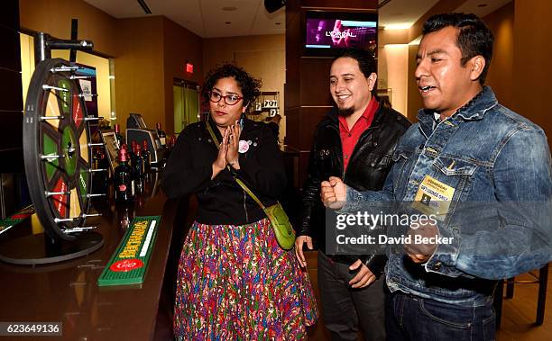 Recording artists Marisol Hernandez, Alex Bendana and Jose Carlos of La Santa Cecilia attend the gift lounge during the 17th annual Latin Grammy...