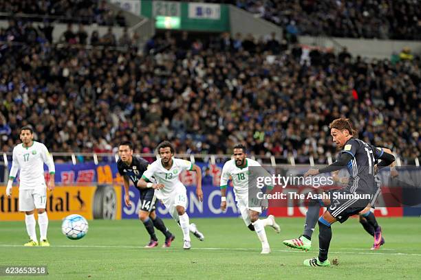 Hiroshi Kiyotake of Japan converts the penalty to score his team's first goal during the 2018 FIFA World Cup Qualifier match between Japan and Saudi...