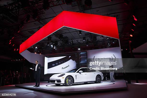 Oliver Blume, chairman of Porsche AG, unveils the Panamera 4 Executive e-hybrid vehicle during Automobility LA ahead of the Los Angeles Auto Show in...
