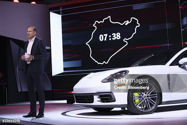 Oliver Blume, chairman of Porsche AG, unveils the Panamera 4 Executive e-hybrid vehicle during Automobility LA ahead of the Los Angeles Auto Show in...