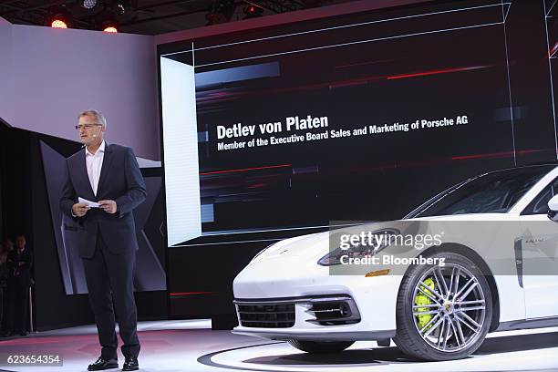Detlev von Platen, head of sales and marketing for Porsche Automobil Holding SE, unveils the Panamera 4 Executive e-hybrid vehicle during...