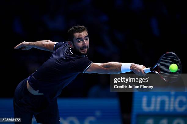 Marin Cilic of Croatia hits a backhand during his men's singles match against Stan Wawrinka of Switzerland on day four of the ATP World Tour Finals...