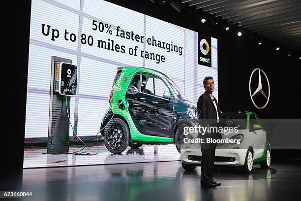 Dietmar Exler, president and chief executive officer of Mercedes-Benz USA LCC, unveils the Smart Electric Drive vehicle during Automobility LA ahead...