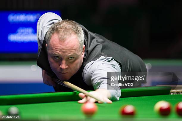 John Higgins of Scotland plays a shot during the second round match against Sam Craigie of England on day three of Coral Northern Ireland Open 2016...