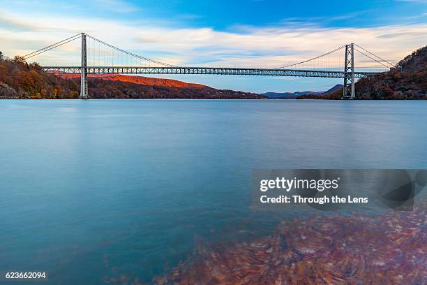 bear mountain bridge with foliage during dawn - bear mountain bridge stock pictures, royalty-free photos & images