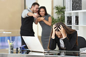 Businesspeople bullying a colleague at office