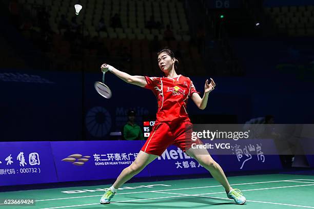 Gao Fangjie of China returns to Mitani Minatsu of Japan during women's singles first round match on day two of BWF Thaihot China Open 2016 at Haixia...