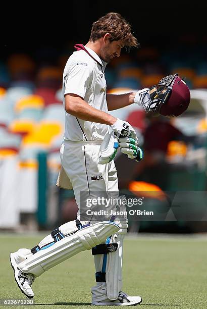 Joe Burns walks off after being dismissed during day one of the Sheffield Shield match between Queensland and South Australia at The Gabba on...