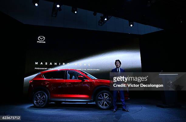 Masa Moro, President and CEO, Mazda North American Operations, speaks onstage at the Mazda press conference event at the L.A. Auto Show on November...
